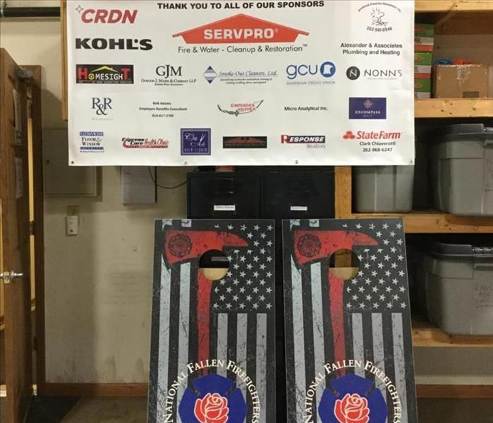 banner showing sponsors for bags tournament