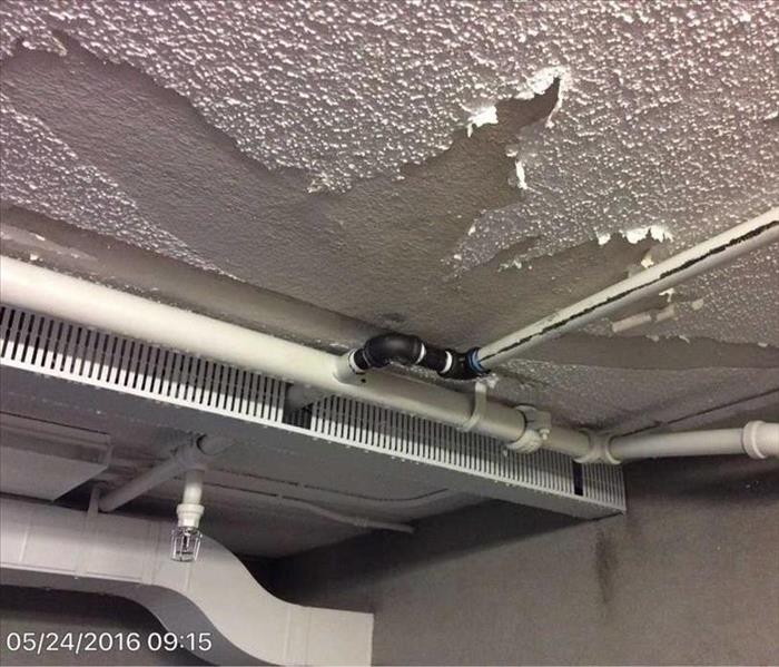 Damaged Conference Room Ceiling With Suspended Water Pipe Which was the Cause of Loss