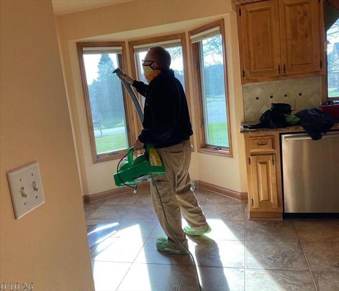 SERVPRO Employee Spraying Chemical To Disinfect Due to COVID-19