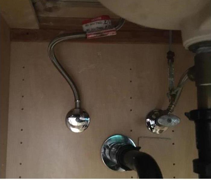 2 water supply line valves connected under the sink