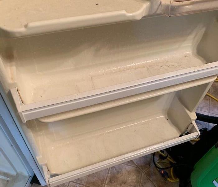 Refrigerator door dirty, before being cleaned