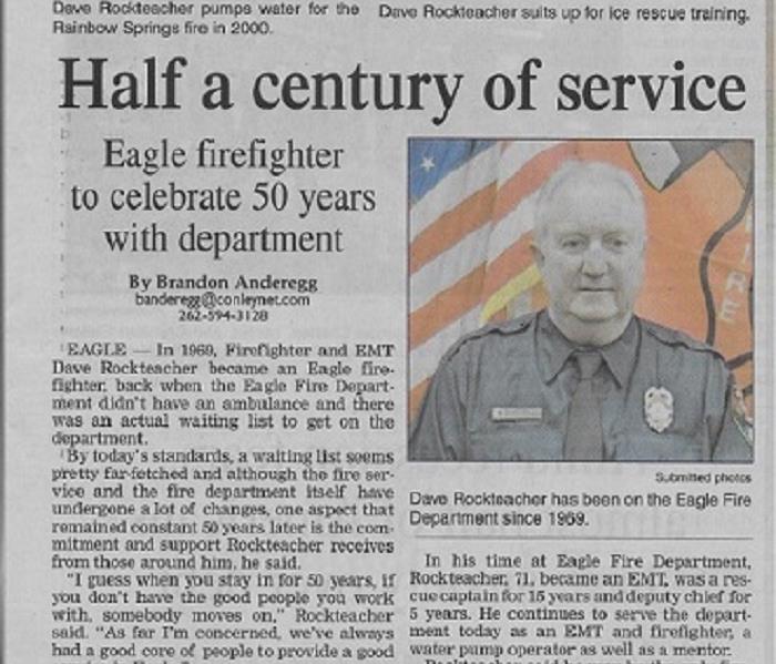 Cut out of newspaper article about local firefighter who has served for 50 years